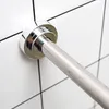 Close-up of a shower curtain rod mounted on a tiled wall. Produktbild-Vorschau