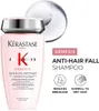A product shot of a Kérastase shampoo bottle with marketing text and icons. Produktbild-Vorschau