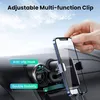 A hand is placing a smartphone into a car air vent phone holder. Náhled obrázku produktu