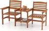 A wooden patio set with two chairs and a connecting table, featuring a bowl of fruit on the table. Náhľad obrázku produktu