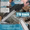 A person is holding a portable electric pruning saw, with cut logs in the background. Produktbild-Vorschau