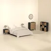 A bedroom scene with a bed, nightstands, and dressers. Podgląd zdjęcia produktu