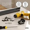 A collection of items for installing a curtain rod, including rods, a drill, a screwdriver, and hardware, laid out on a surface. Podgląd zdjęcia produktu