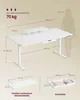 A diagram showing the dimensions and features of a white standing desk, with a silhouette of a person for scale. Produktbild-Vorschau