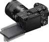 A black Sony Alpha 6700 digital camera with a lens attached, shown from a rear-diagonal angle with the screen flipped out. Náhled obrázku produktu