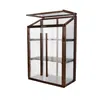 A wooden and polycarbonate mini greenhouse with shelves, shown against a white background. Voir les images du produit