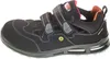 A black safety sandal with orange and red accents, shown from the side against a white background. Produktbild-Vorschau