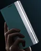 A hand holding a teal and silver smartphone case. Produktbild-Vorschau