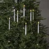 LED candles with heart ornaments hanging on a Christmas tree. Podgląd zdjęcia produktu