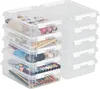 A stack of clear plastic storage boxes filled with various items. Produktbild-Vorschau