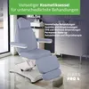 A cosmetic chair in a treatment room with cabinets and a sink in the background. Produktbild-Vorschau