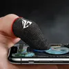 A finger wearing a gaming glove is touching a smartphone screen displaying a game. Produktbild-Vorschau