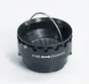 A black coffee grinder adjustment mechanism with a metal handle and white text indicating settings. Podgląd zdjęcia produktu