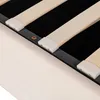 Close-up view of a bed frame's wooden slats and metal support structure. Podgląd zdjęcia produktu