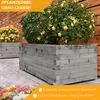 Two gray wooden planters with plants in them, set against a wooden fence. Produktbild-Vorschau