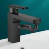 A black faucet extension is shown against a teal background and a white sink. Náhľad obrázku produktu