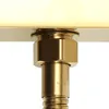 A close-up view of a gold-colored faucet fixture, showing a hexagonal nut and a cylindrical part with the letters 'JOW' embossed on it. Podgląd zdjęcia produktu