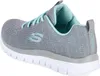 A side view of a single Skechers sneaker. Voir les images du produit