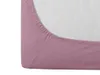 A close-up view of the corner of a pink fitted sheet. Náhled obrázku produktu