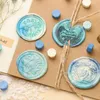 Wax seal beads are arranged on a brown card with twine, suggesting a crafting or stationery context. Náhled obrázku produktu
