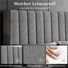 Close-up view of a grey upholstered headboard with text overlays highlighting product features. Produktbild-Vorschau