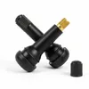 Two black tire valves are crossed over each other, with a black valve cap placed to the side. Produktbild-Vorschau