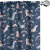A close-up view of a dark blue curtain with a repeating pattern of cartoon unicorns, rainbows, and stars.