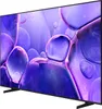 A side view of a large flat-screen television with a colorful abstract display. Voir les images du produit
