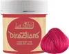A jar of La Riché Directions Flamingo Pink hair dye is shown next to a swatch of the colored hair. Produktbild-Vorschau