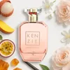 A perfume bottle surrounded by fruits and flowers. Náhled obrázku produktu