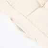 A close-up view of a cream-colored cushion, showing its textured fabric and a decorative knot detail. Produktbild-Vorschau