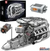 A detailed model of a V8 twin-turbo engine, along with its packaging and a control unit, displayed on a white background. Produktbild-Vorschau