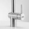 A close-up studio shot of a modern stainless steel kitchen faucet. Podgląd zdjęcia produktu
