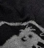 A close-up view of a knitted fabric with a pattern. Produktbild-Vorschau