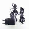 A black power adapter and two black cables are laid out on a white background. Anteprima dell’immagine prodotto