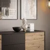 A dresser with decorative items on top, including a bust and books. Produktbild-Vorschau