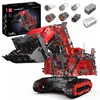 A large red and black remote-controlled excavator model, with several smaller motor components and battery packs arranged above it, and a product box in the background. Produktbild-Vorschau