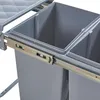 A close-up view of a gray built-in trash can with two compartments and a sliding mechanism. Podgląd zdjęcia produktu