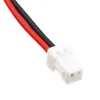 A close-up of a white connector with two wires, one red and one black, attached. Náhľad obrázku produktu