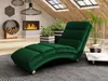 A modern living room with a fireplace, plants, and a chaise lounge. Náhled obrázku produktu