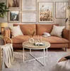 A living room scene featuring a couch, coffee table, and artwork. Náhľad obrázku produktu