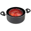 A black pot with a stainless steel steamer insert filled with sliced red vegetables. Produktbild-Vorschau