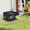 A robotic lawn mower is parked under a black metal garage shelter next to a ladder and a hose reel. Produktbild-Vorschau