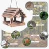 A wooden bird feeder with various birds shown in circular insets around it, set against a forest background. Podgląd zdjęcia produktu