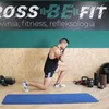 A man is performing a lunge exercise with resistance bands in a gym. Náhled obrázku produktu