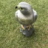 A realistic falcon statue is placed on a grassy lawn. Náhľad obrázku produktu