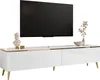 A modern white TV stand with gold accents and slanted legs, featuring a large black TV mounted above it. Decorative items, including a bust and a vase with dried flowers, are placed on the stand. Produktbild-Vorschau