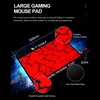 A close-up marketing image of a large gaming mouse pad with a red and black crackle pattern. Dimensions and features are highlighted with text and callout circles. Voir les images du produit