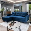 A modern living room with a blue sectional sofa, coffee table, and staircase.