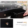 A close-up view of a black vanity drawer with a crystal knob, and a hand reaching for another drawer. Text overlays highlight features. Produktbild-Vorschau